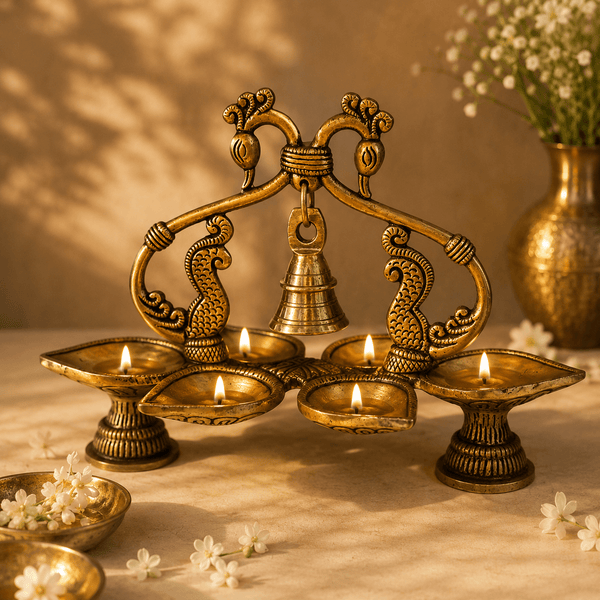 Mayura Pancha Deepa - Handcrafted Brass Five-Flame Oil Lamp · Double Peacock Arch · Suspended Bell · Antique Gold - Kanasu Artifacts